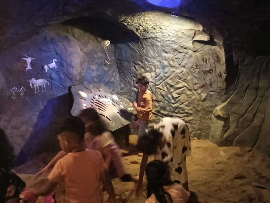 Children at a cave-painting exhibit designed and built by S2S