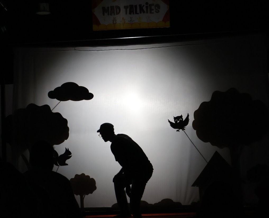 A shadow puppet show under way at Mad Talkies